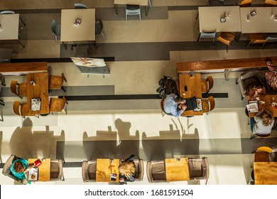 TEL-AVIV, ISRAEL - FEBRUARY 26, 2020: Top View Of The Cafeteria, Where People Sit At Each Table, Eat, Dine And Do Business. Horizontal View.