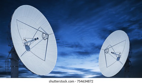 Telecom Satellite Array And Sunset Background