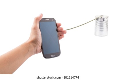 Telecommunication concept image of female hand holding a smart phone connecting to a tin can phone.