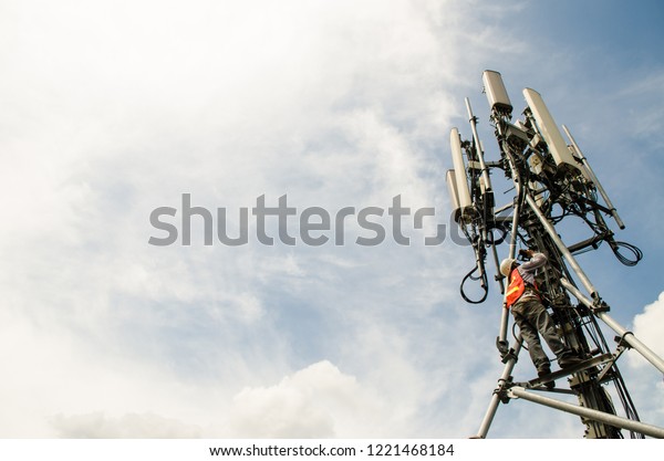 Telecommunication Engineer Working On High Towerrisk Stock Photo ...