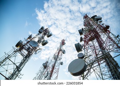 Telecommunication mast TV antennas wireless technology with blue sky in the morning - Shutterstock ID 226031854