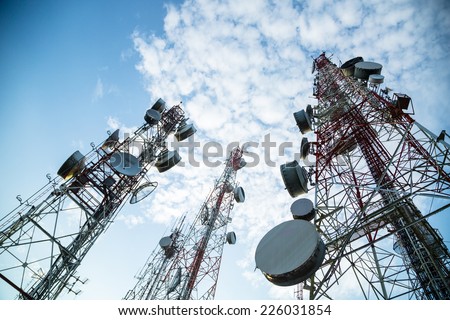 Telecommunication mast TV antennas wireless technology with blue sky in the morning