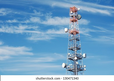 Telecommunication Radio Antenna And Satelite Tower With Blue Sky