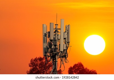 Telecommunication tower of 4G and 5G. Wireless Communication Antenna Transmitter. Development of communication systems in urban area against sunset background.