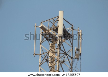 Telecommunication tower of 4G cellular. Macro Base Station. 4G cellular network telecommunication equipment with smart antennas mounted on a metal on sky background cellphone tower 

