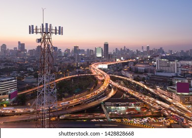 Telecommunication Tower With 5G Cellular Network Antenna On City Background