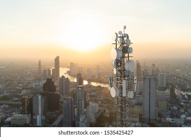 Telecommunication tower with 5G cellular network antenna on city background - Shutterstock ID 1535425427