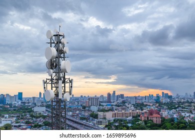 Telecommunication Tower With 5G Cellular Network Antenna On City Background