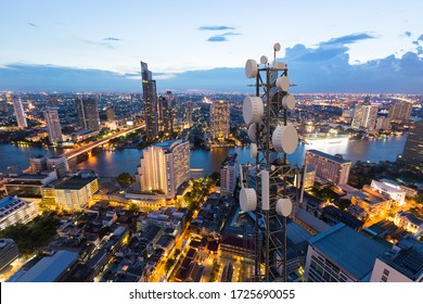 Telecommunication Tower With 5G Cellular Network Antenna On City Background