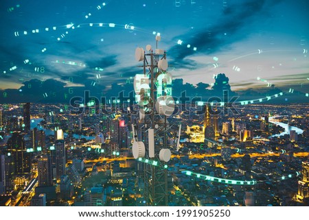 Telecommunication tower with 5G cellular network antenna on night city background, Digital big data concept