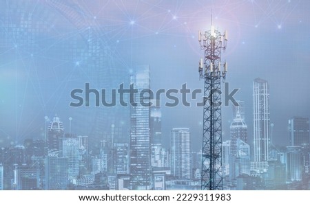 Telecommunication tower with 5G cellular network antenna on city background.