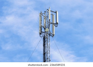 Telecommunication tower with blue sky background. Technology and communication concept.