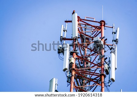 Telecommunication tower with blue sky in the background 