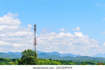Telecommunication tower in boondocks remote area with forest and mountain background for telecommunication infrastructure concept. - Shutterstock ID 2313339919