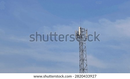 Telecommunication Tower Cellular Base Transceiver Station BTS Against Blue Sky