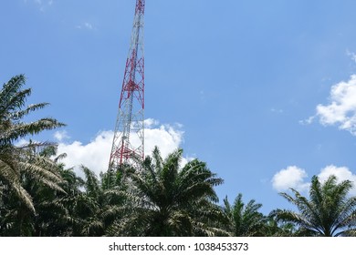 The telecommunication tower in sky with clouds background