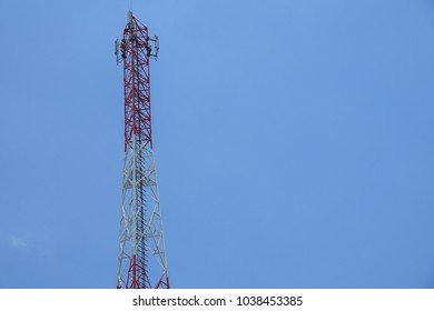 The telecommunication tower in sky with clouds background