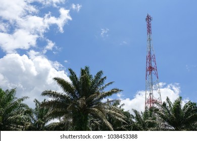 The telecommunication tower in sky with clouds background
