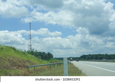 The telecommunication tower in sky with clouds background
