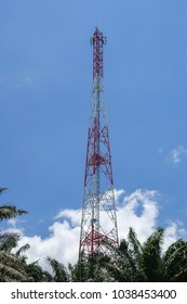 The telecommunication tower in sky with clouds background