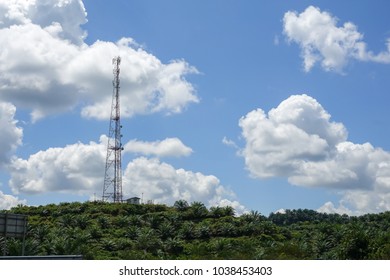 The telecommunication tower in sky with clouds background