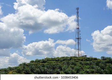 The telecommunication tower in sky with clouds background