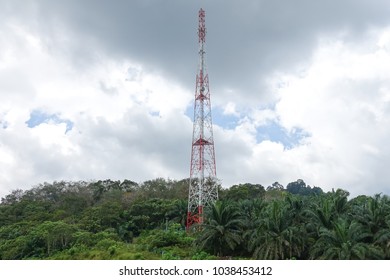 The telecommunication tower in sky with clouds background