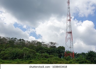 The telecommunication tower in sky with clouds background