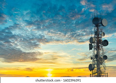 Telecommunication Tower At Sunset Sky Background