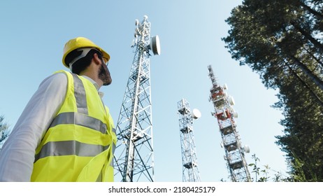 Telecommunications engineer turns to the radio antennas - Shutterstock ID 2180425179