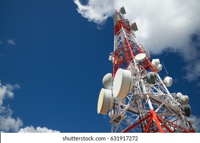 Telecommunications Tower With Cloudy Sky.