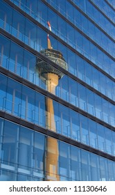 Telecommunications Tower reflected in a skyscraper
