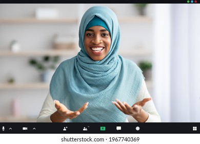 Teleconference Concept. Screenshot Of Cheerful Black Muslim Woman Making Video Call, Friendly African Islamic Woman In Headscarf Talking And Gesturing At Camera, Creative Collage, POV Interface - Powered by Shutterstock