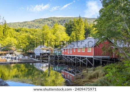 The Telegraph Cove marina and accommodations built on pilings surrounding this historic location, Telegraph Cove, Vancouver Island, British Columbia, Canada.
