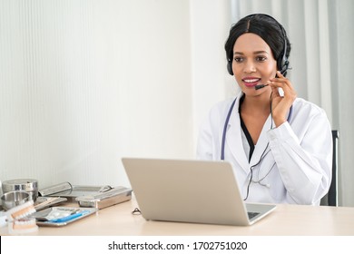 Telehealth, African American Doctor In Headset Consulting With The Patient Over The Phone. Health Care Call Center Online Concept