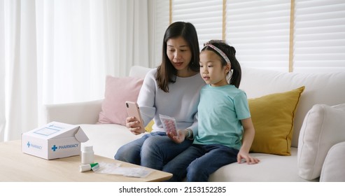 Telehealth telemedicine care mobile app exam visit service asia people. Worry mom and sick kid girl ask doctor in video call talk VoIP clinic self cure with cold flu Rx box pill at sofa home isolate. - Powered by Shutterstock