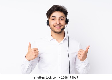 Telemarketer Arabian Man Working With A Headset Isolated On White Background Giving A Thumbs Up Gesture