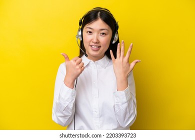 Telemarketer Chinese Woman Working With A Headset Isolated On Yellow Background Counting Six With Fingers