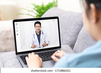 Telemedicine Asian Doctor Video Conference Call Online Talking For Follow Up Remotely With Medical Coronavirus Result At Home.Online Healthcare Digital Technology Service, Counselor And Interview App.