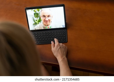 Telemedicine Concept - Rear View Of Woman Has Video Chat With Female Doctor By Digital Tablet