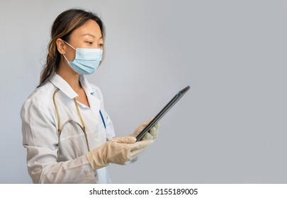 Telemedicine, Medical online, e health concept. Doctor video chat , explaining with patient via tablet computer, mobile health application. Doctor teleconferencing with medical team in hospital