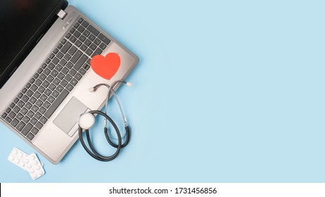 Telemedicine Or Telehealth Virtual Visit, Video Visit, Remote Doctor Video Chat Consultation Concept With Laptop, Smartphone, Notepad And Stethoscope On Blue Background.