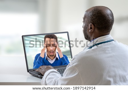 Telemedicine telehealth-Corona virus on ligne consultation -doctor during a video consult with a patient with a cold and headache
