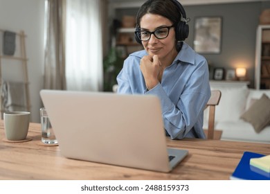 Telemedicine. Young woman doctor working at home office, private general practitioner, healthcare and medical female worker using laptop computer for contact with senior patients Helping people online - Powered by Shutterstock