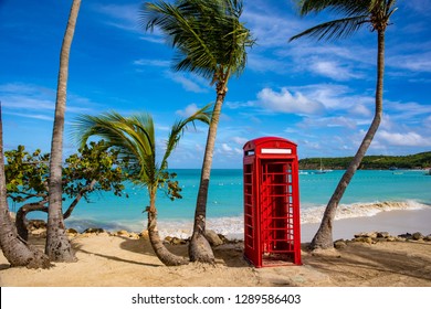 Telephone booth on a beautiful beach in Dickenson Bay on Antigua in the Caribbean.