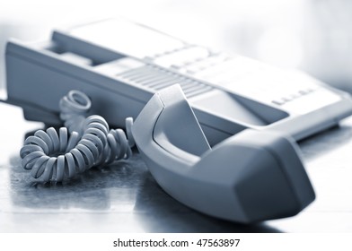 Telephone Handset Off The Hook On Desk