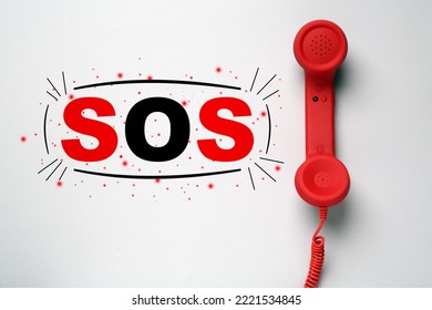 Telephone Handset On Light Grey Background, Top View. Emergency SOS Call