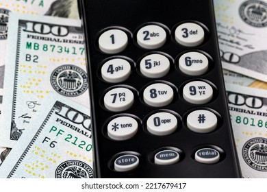 Telephone Keypad And Cash Money. Telemarketing, Robocall And Phone Scams Concept