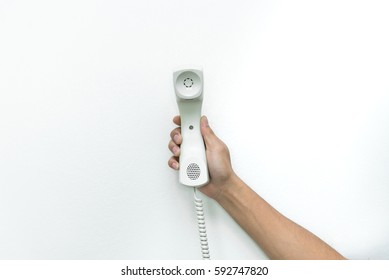 Telephone With Line In Hand On White Background