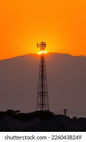 Telephone tower, radio tower during sunset. Telecommunication Tower for 2G 3G 4G 5G network, Cellular phone antenna, BTS, microwave, repeater, base station, IOT.telecommunication tower on golden sky - Shutterstock ID 2260438249